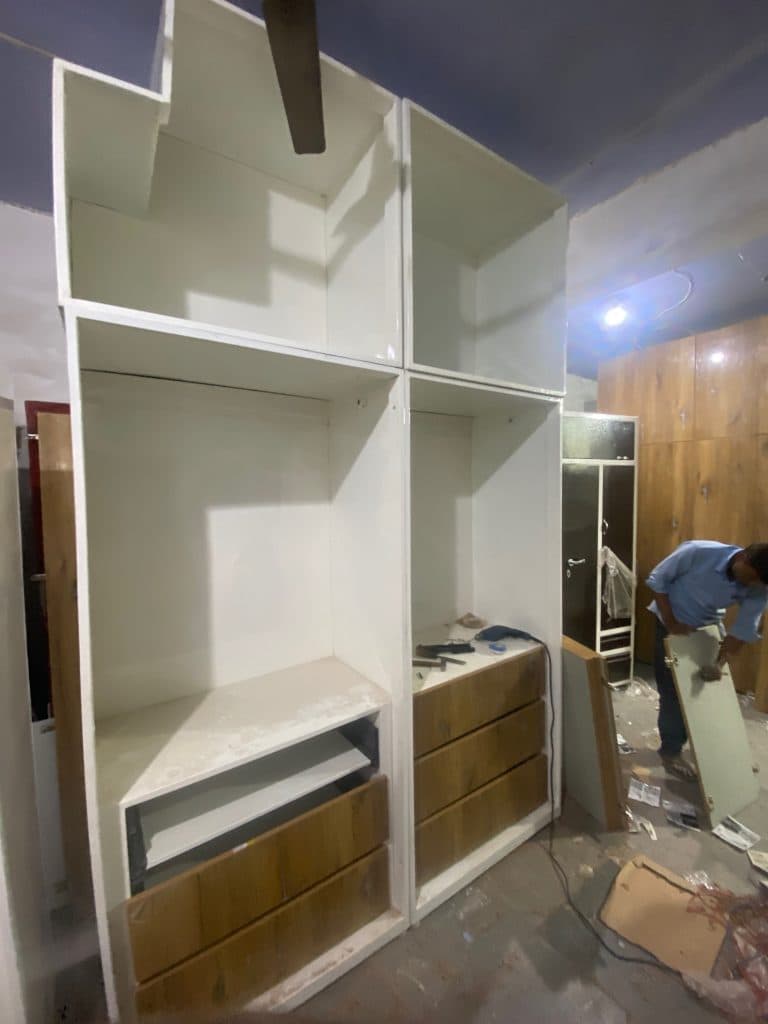 Custom steel almirah frame and drawer installation